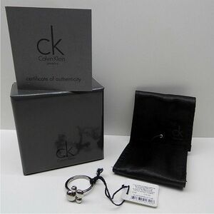 Calvin Klein Liquid Silver Rotatable, Spinner “Fidget,” Charm Ring. Sz 7
NWT